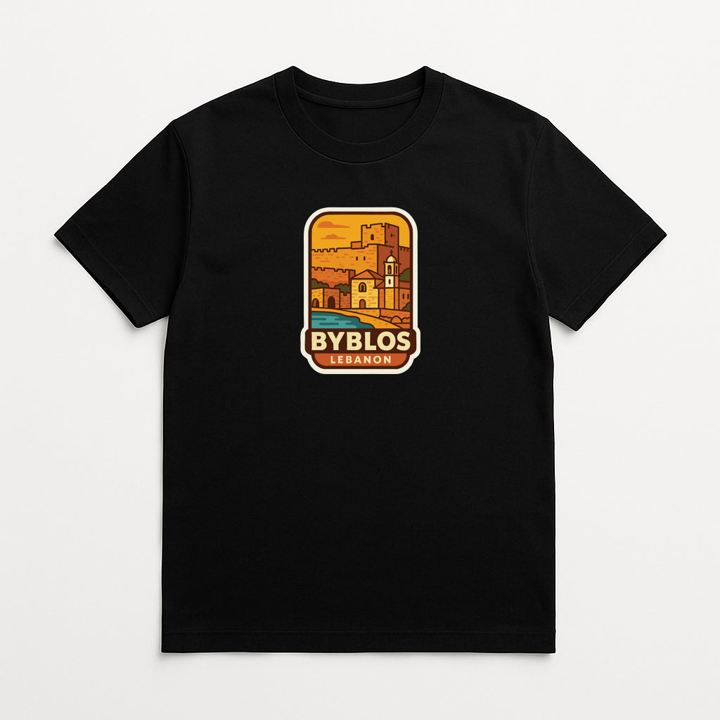 A black t-shirt with a graphic design depicting a cityscape and the text "BY BLOS LEBANON" printed on it.