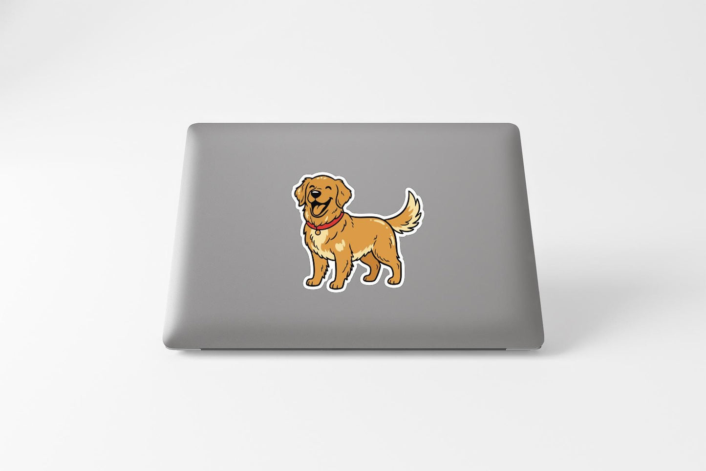 A sticker of a cartoon dog on the back of a laptop computer.