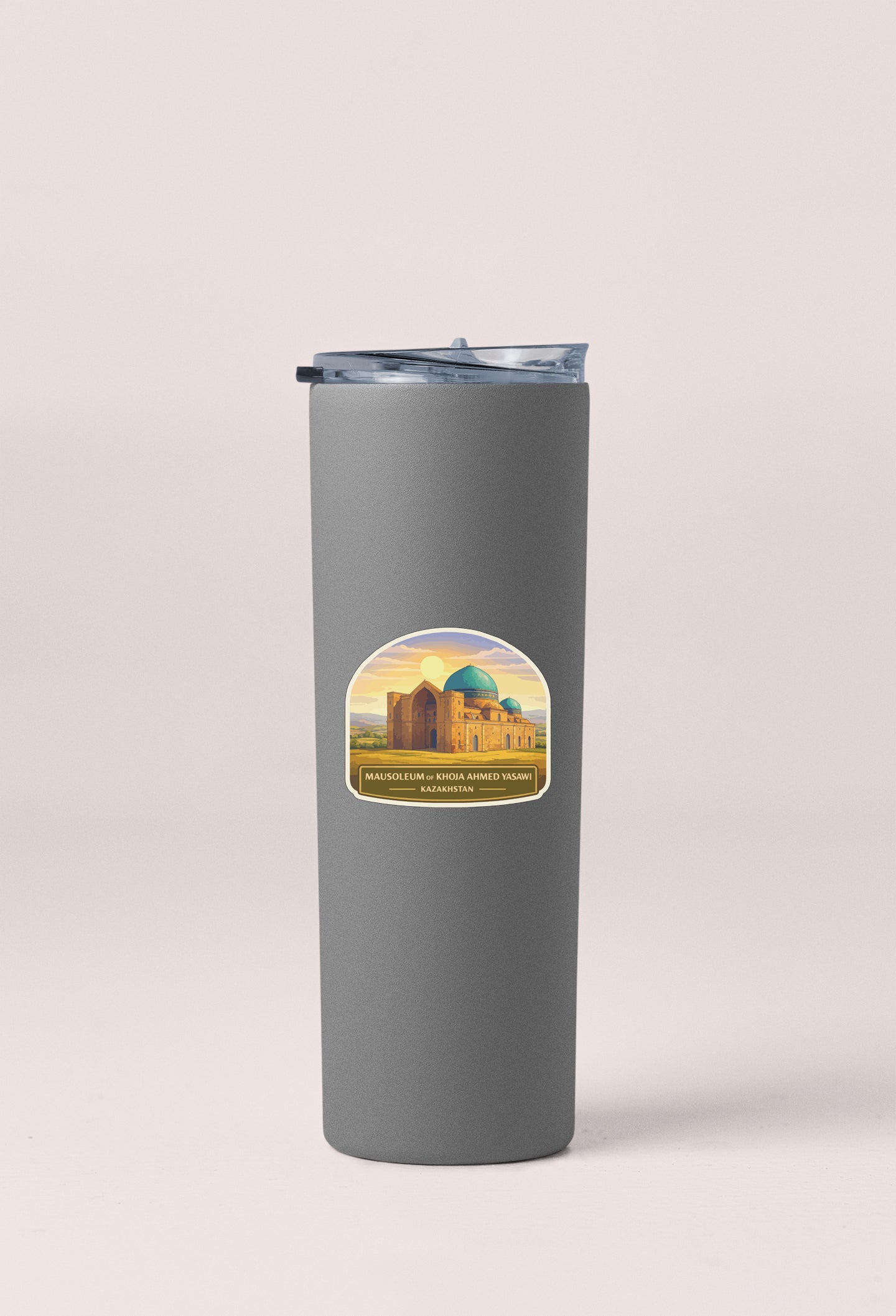 A gray cylindrical container with a lid and a sticker depicting a building with a dome and a sunset in the background.
