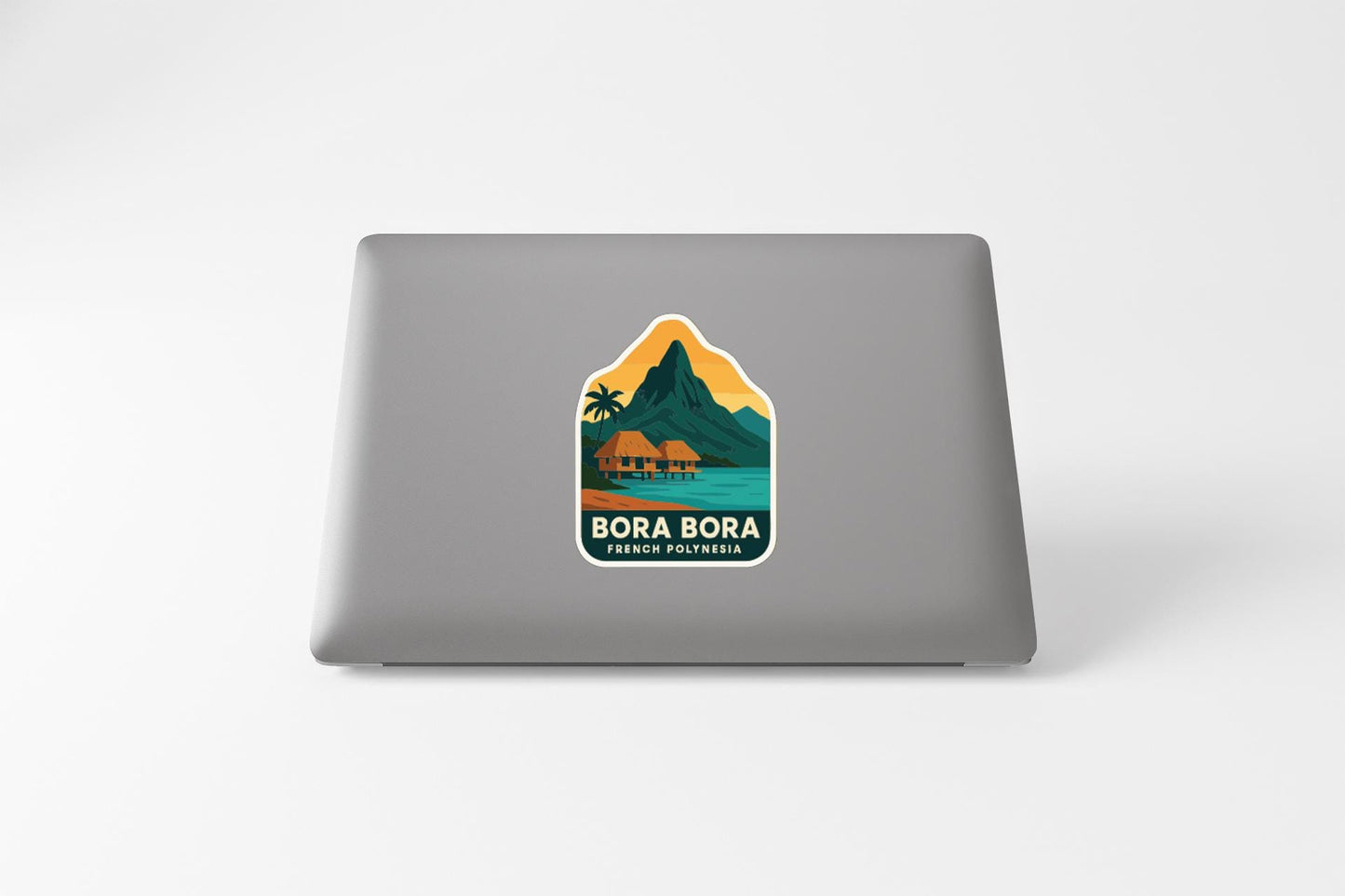 a sticker with a tropical island landscape and a mountain, with the text "BORA BORA FRENCH POLITICO".