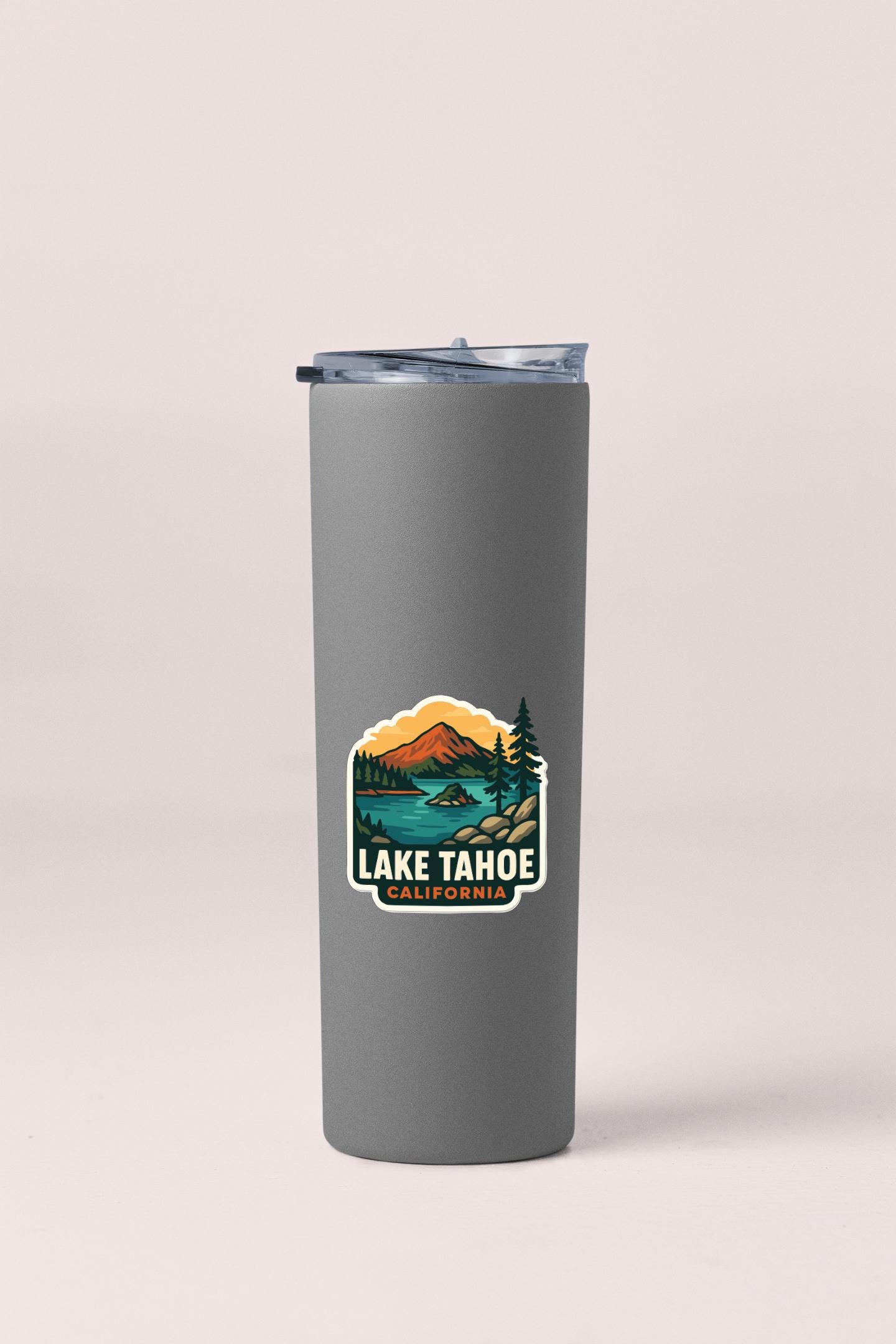A gray insulated tumbler with a printed label that says "Lake Tahoe, California".