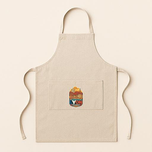A beige apricot with a colorful graphic design on the front pocket.