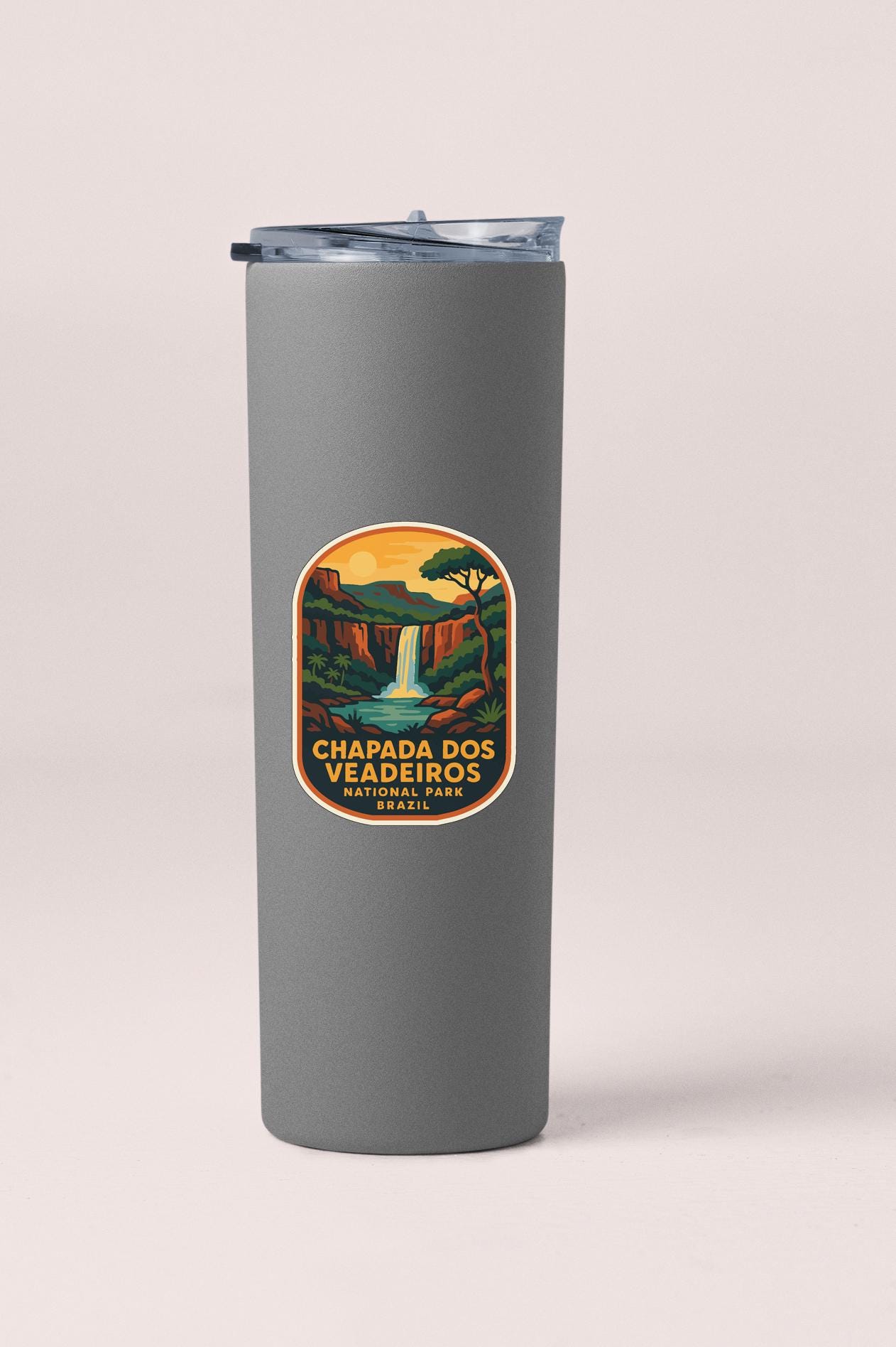 A gray tumbler with a label that says "Chapada dos Veadeiros, Nacional Park, Brazil".