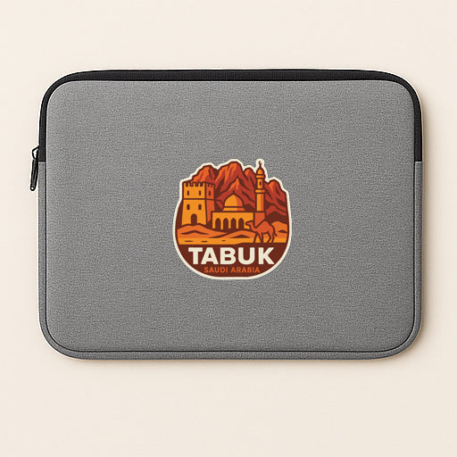 a gray laptop sleeve with a circular logo on it, depicting a cityscape with mountains and a tower.