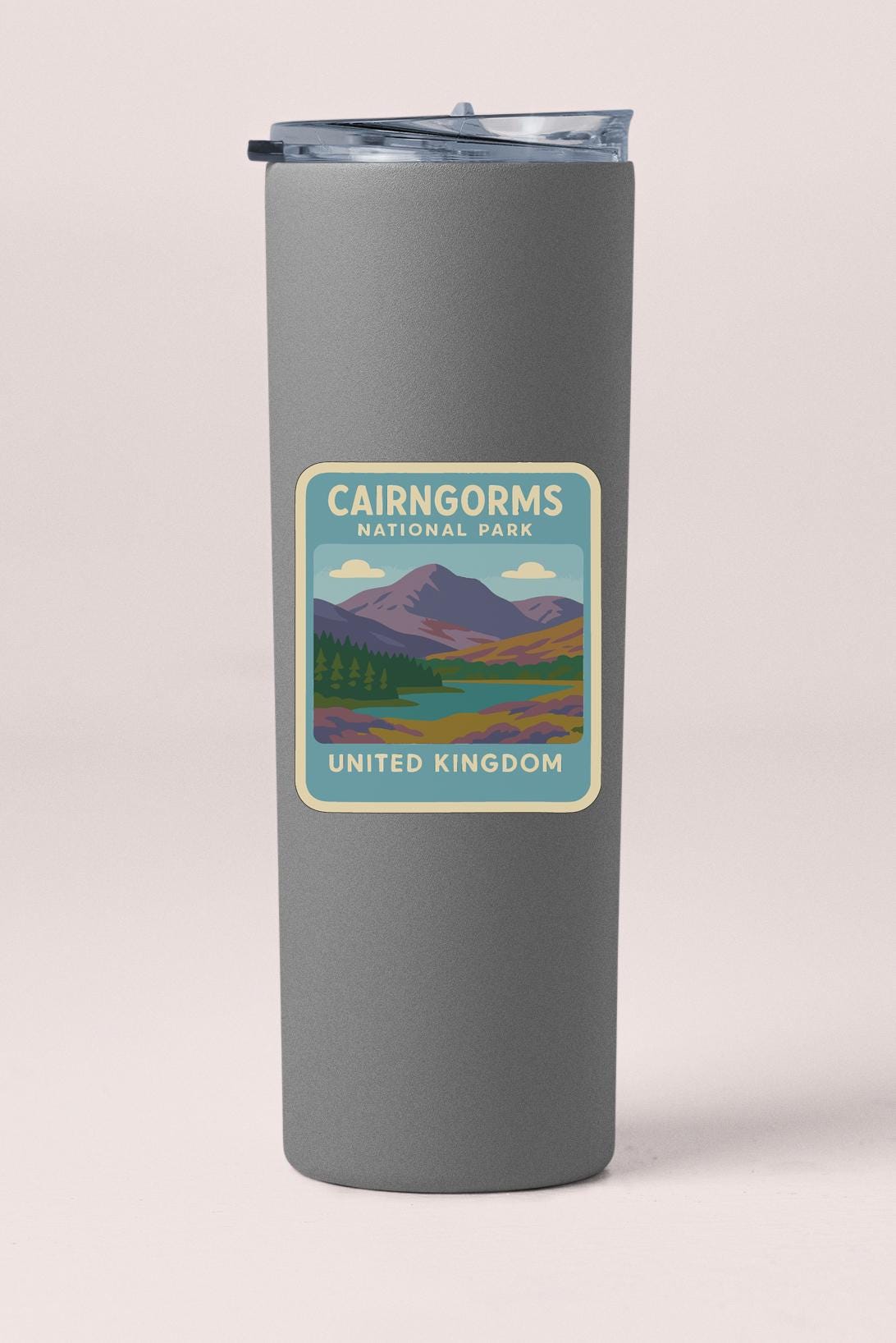 A gray cylindrical container with a label that reads "CAIRNGORMS NATIONAL PARK UNITED KINGDOM".