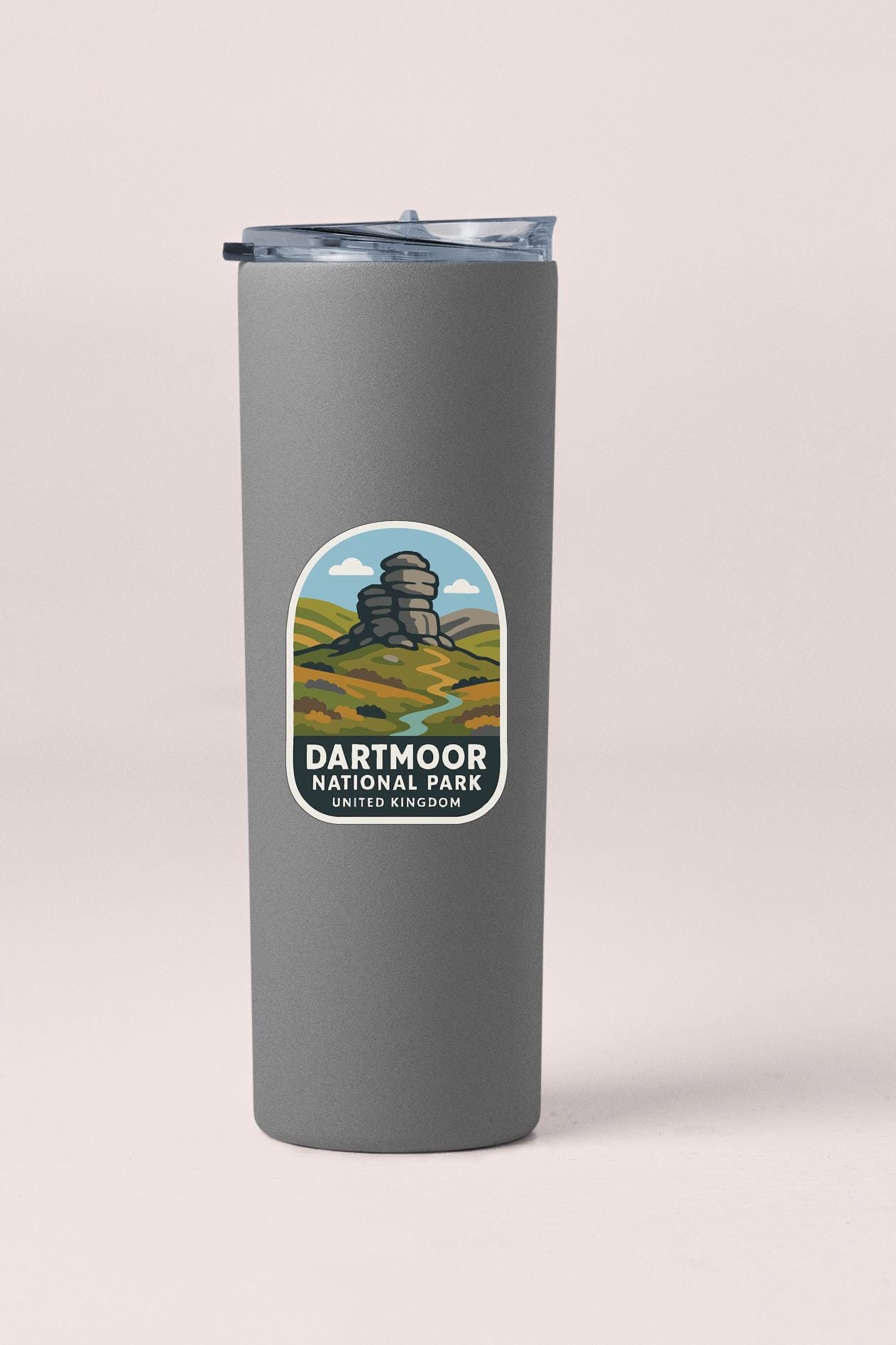 A gray insulated tumbler with a label that says "Dartmoor National Park United Kingdom".