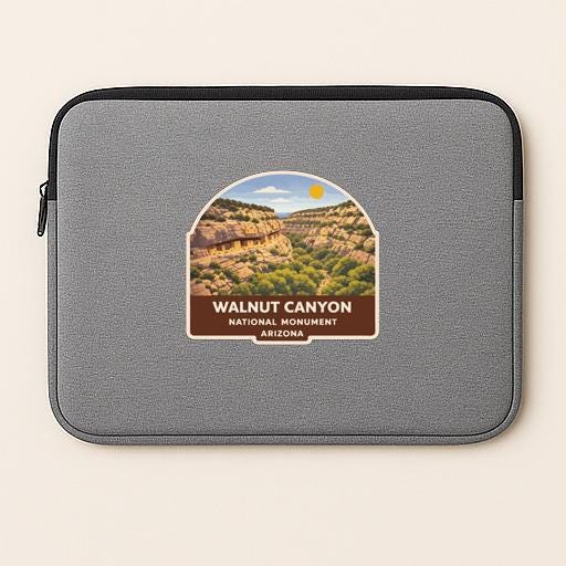 A gray laptop sleeve with a sticker of the Walnut Canyon National Monument in Arizona.