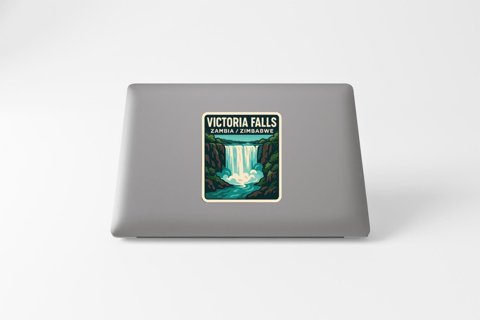 a sticker or decal of Victoria Falls on the back of a laptop computer.