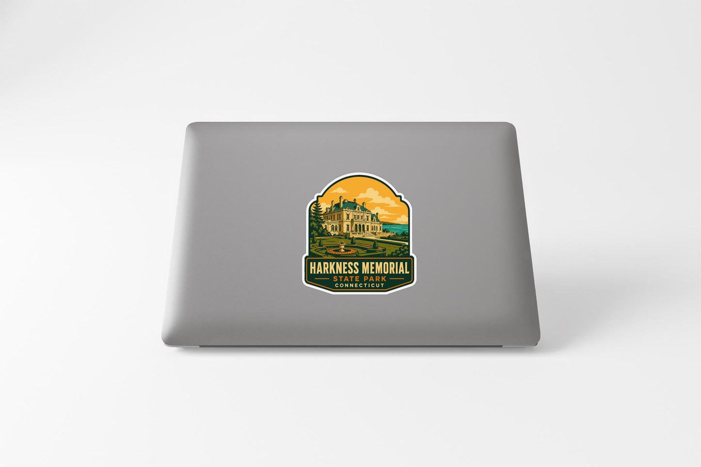 a sticker on the back of a laptop that displays a castle or palace-like structure, with the text "HARKNESS MEMORIAL" and "STANDARD" below it.