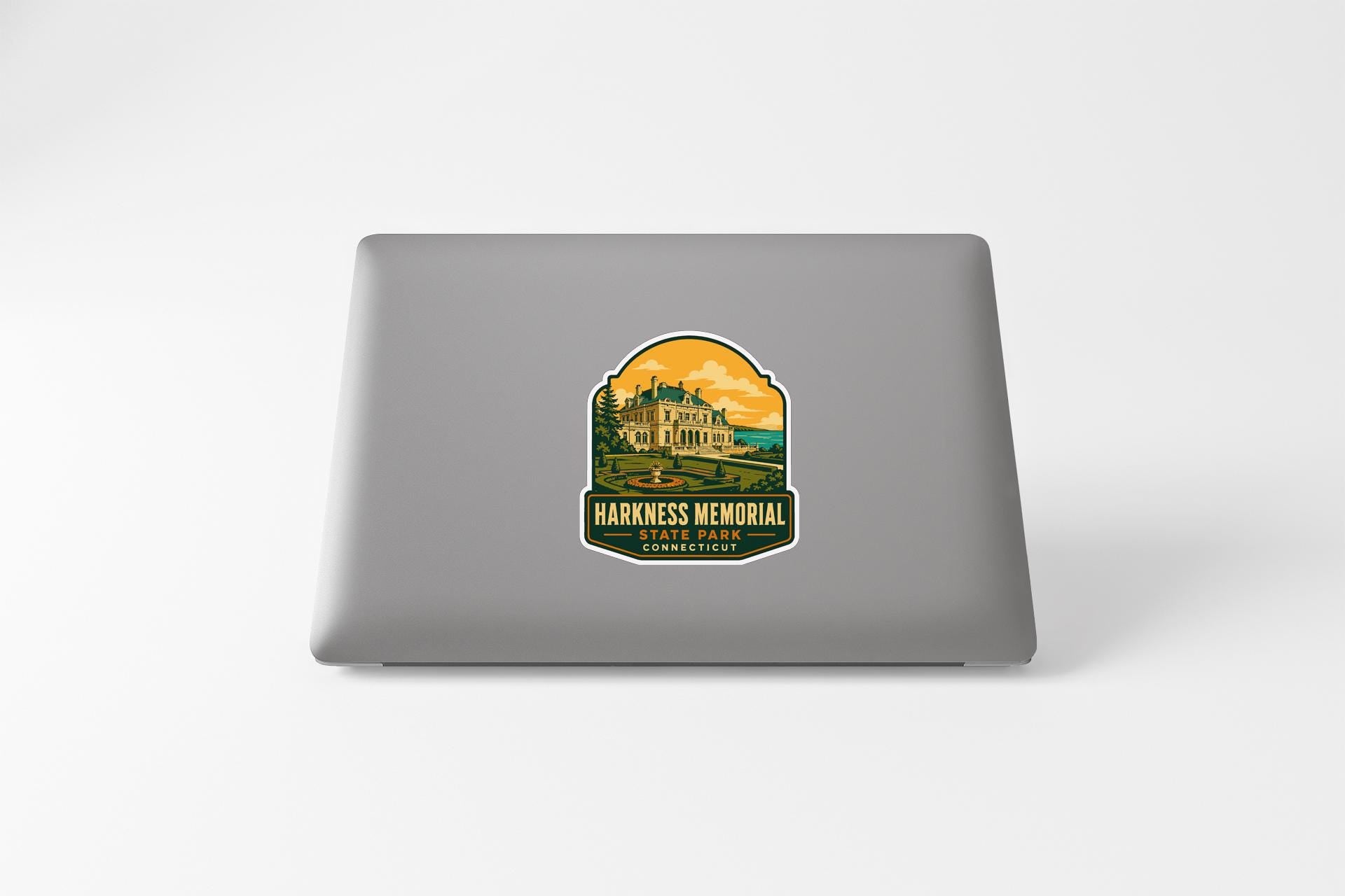 a sticker on the back of a laptop that displays a castle or palace-like structure, with the text "HARKNESS MEMORIAL" and "STANDARD" below it.