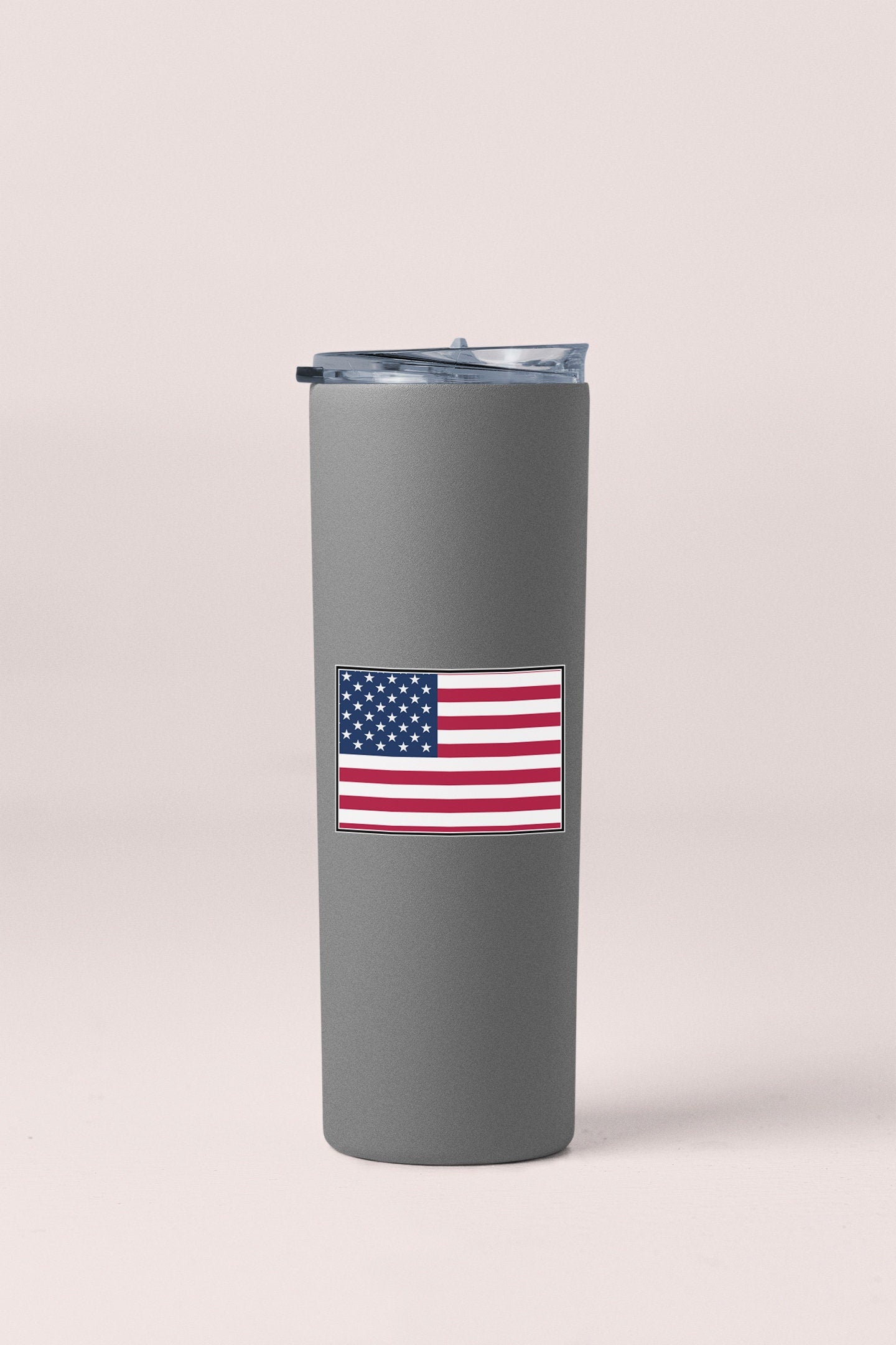 a stainless steel tumbler with the american flag on it