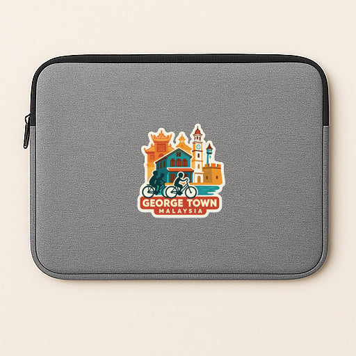 A gray laptop sleeve with a colorful sticker depicting landmarks and a person riding a bicycle.