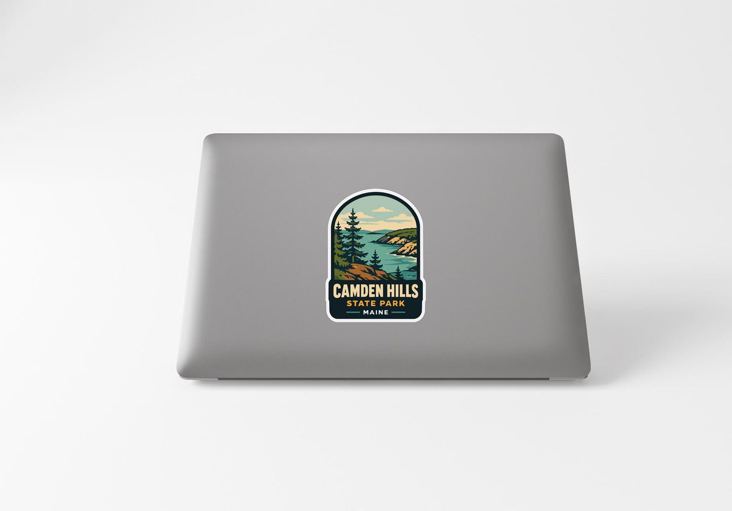 a sticker with a scenic landscape on a laptop.