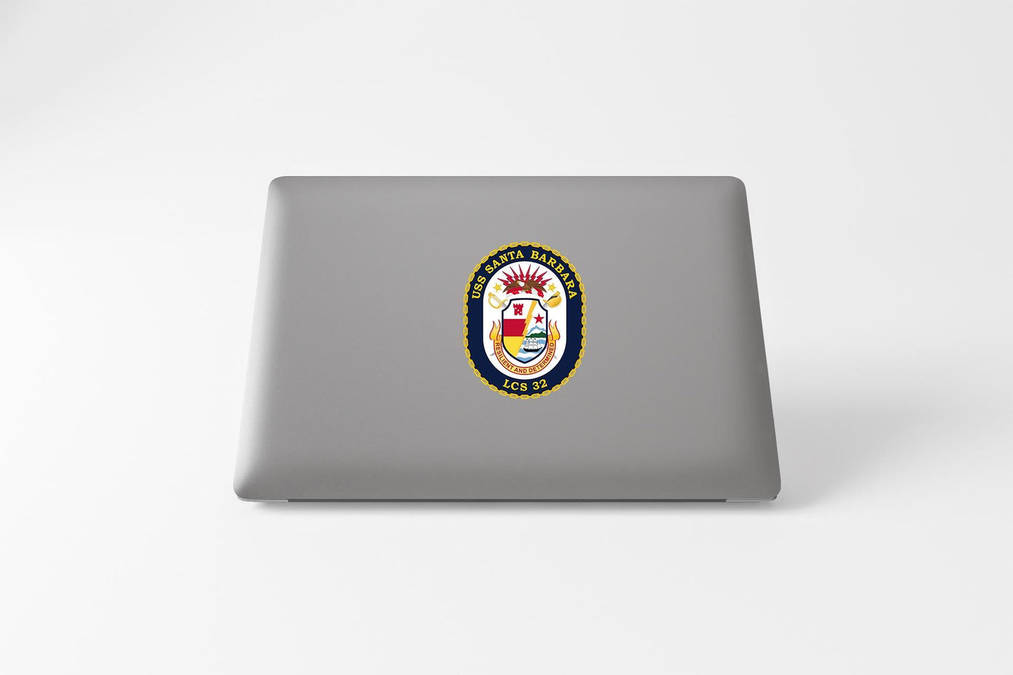 a laptop computer with a coat of arms on it