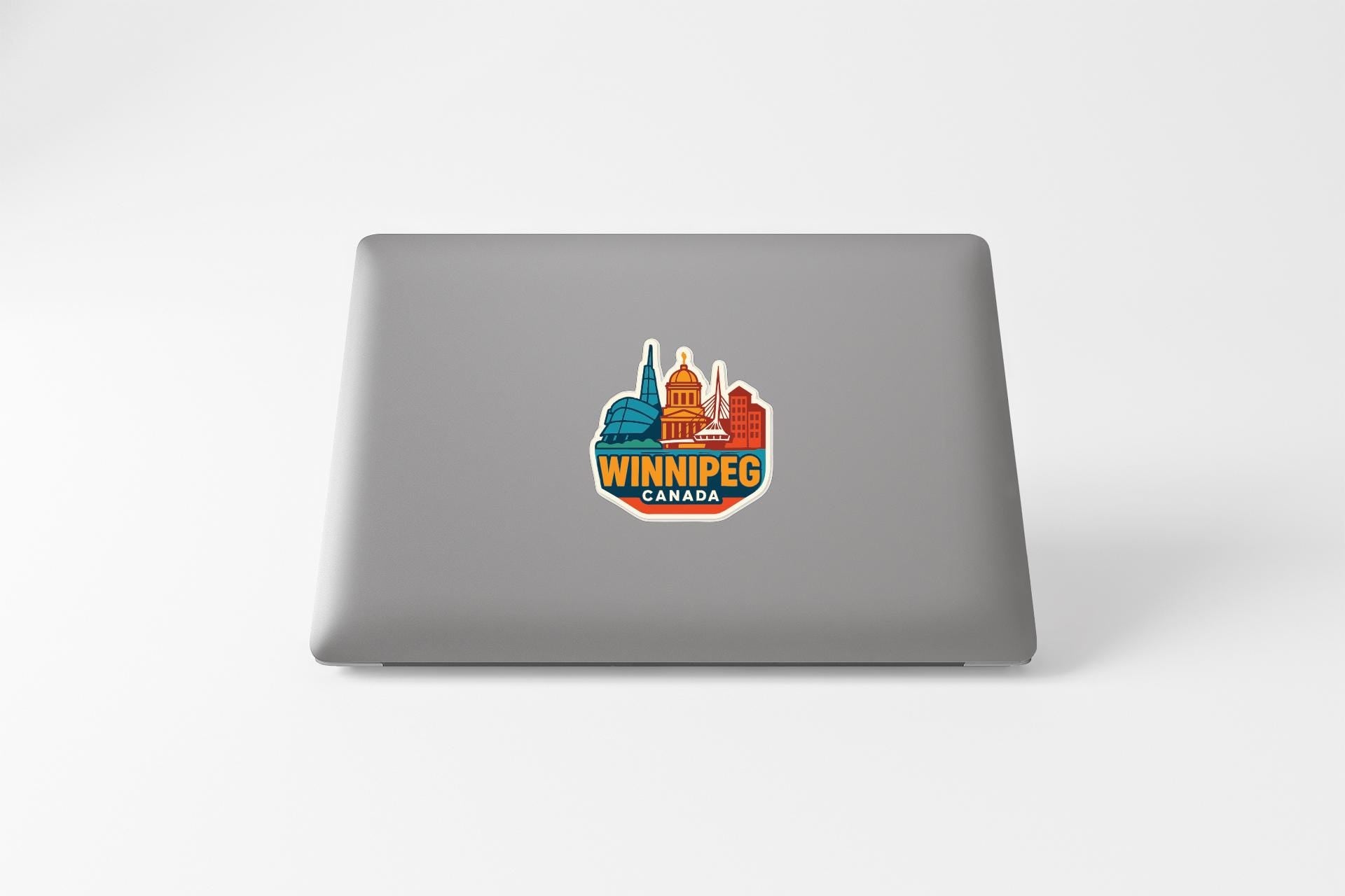 A sticker on the back of a laptop displaying the city of Winnipeg, Canada.