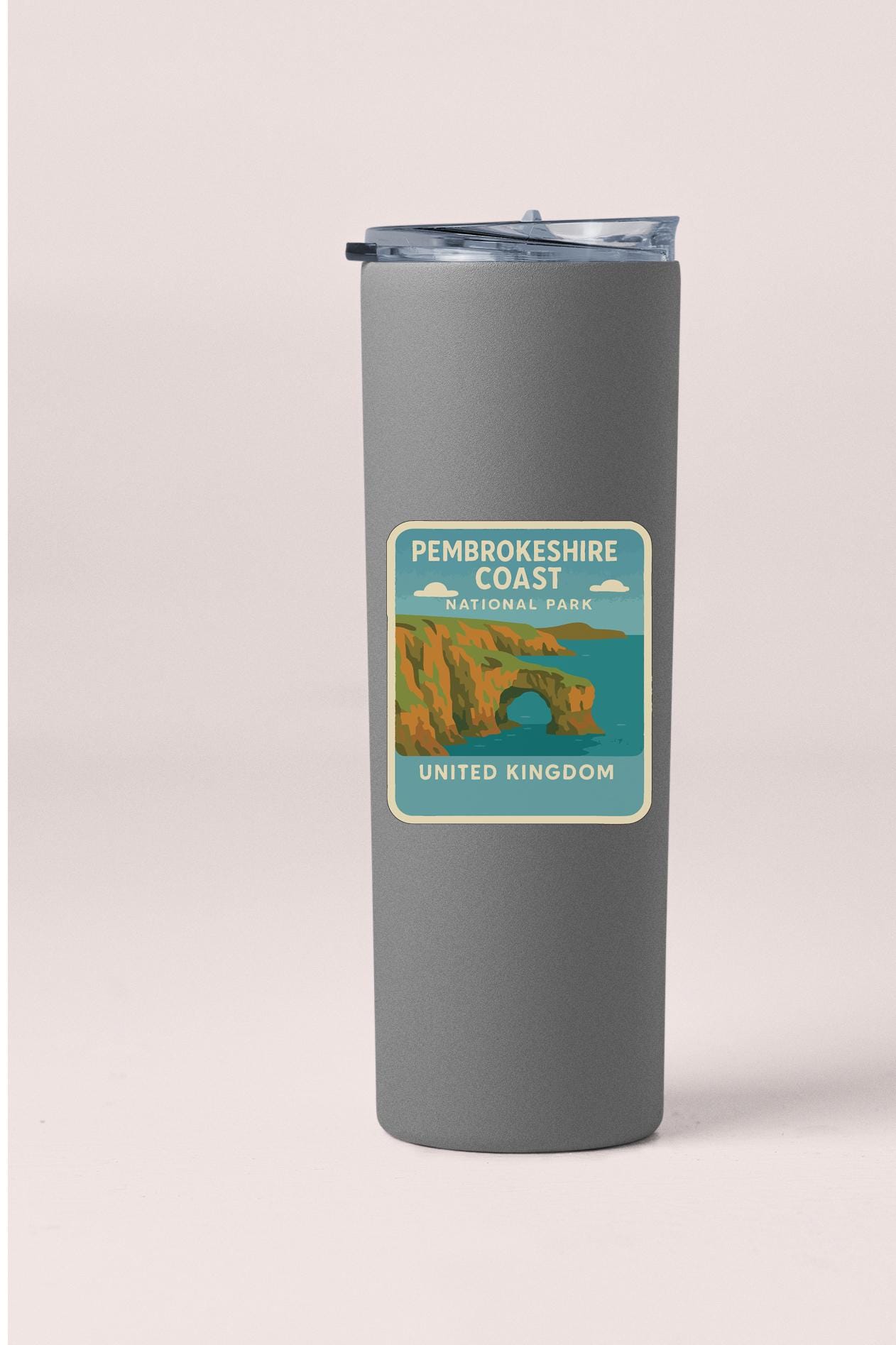 A gray insulated tumbler with a label that reads "Pembrokeshire Coast National Park United Kingdom".
