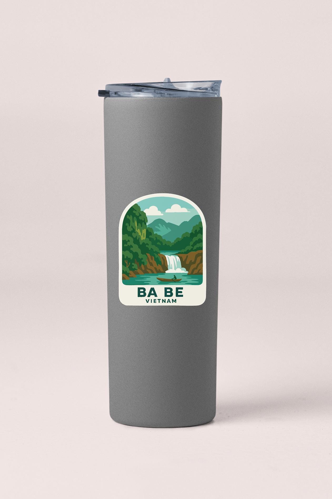 A gray insulated tumbler with a sticker depicting a waterfall and mountains, along with the text "BA BE VIETNAM".