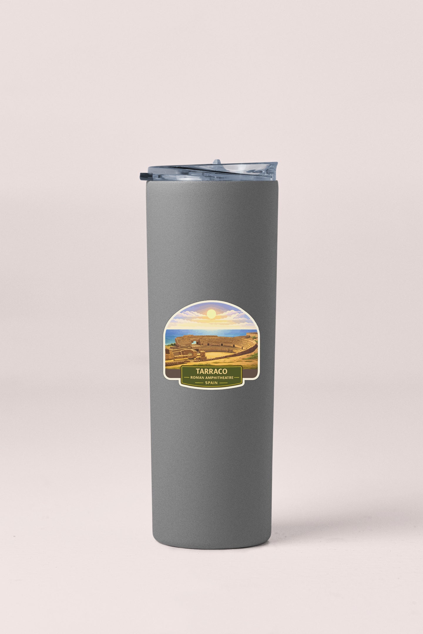 A gray insulated tumbler with a label that says "TARRACO" and "SPANISH PEOPLES".