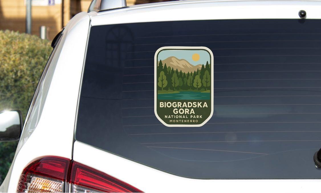a sticker on the rear window of a car that says "Biogradska Gora National Park Montenergo".
