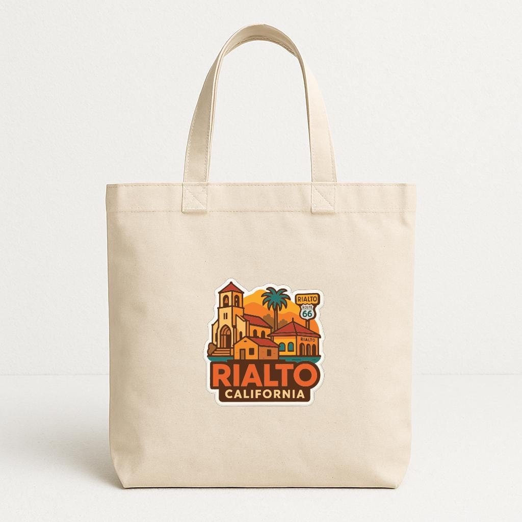 A beige tote bag with a printed design of a building and palm trees, along with the text "RIALTO CALIFORNIA" and a highway sign.