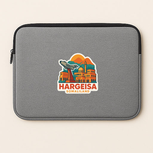 A gray laptop sleeve with a sticker depicting a cityscape and the text "Hargeisa Somaliland".