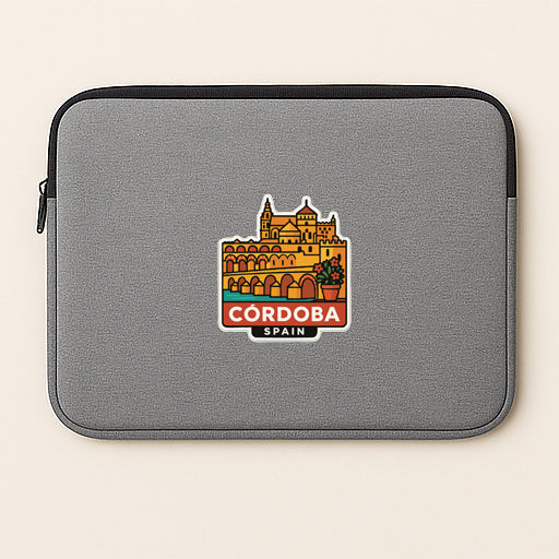 a gray laptop sleeve with a colorful graphic of Cordoba, Spain, on it.