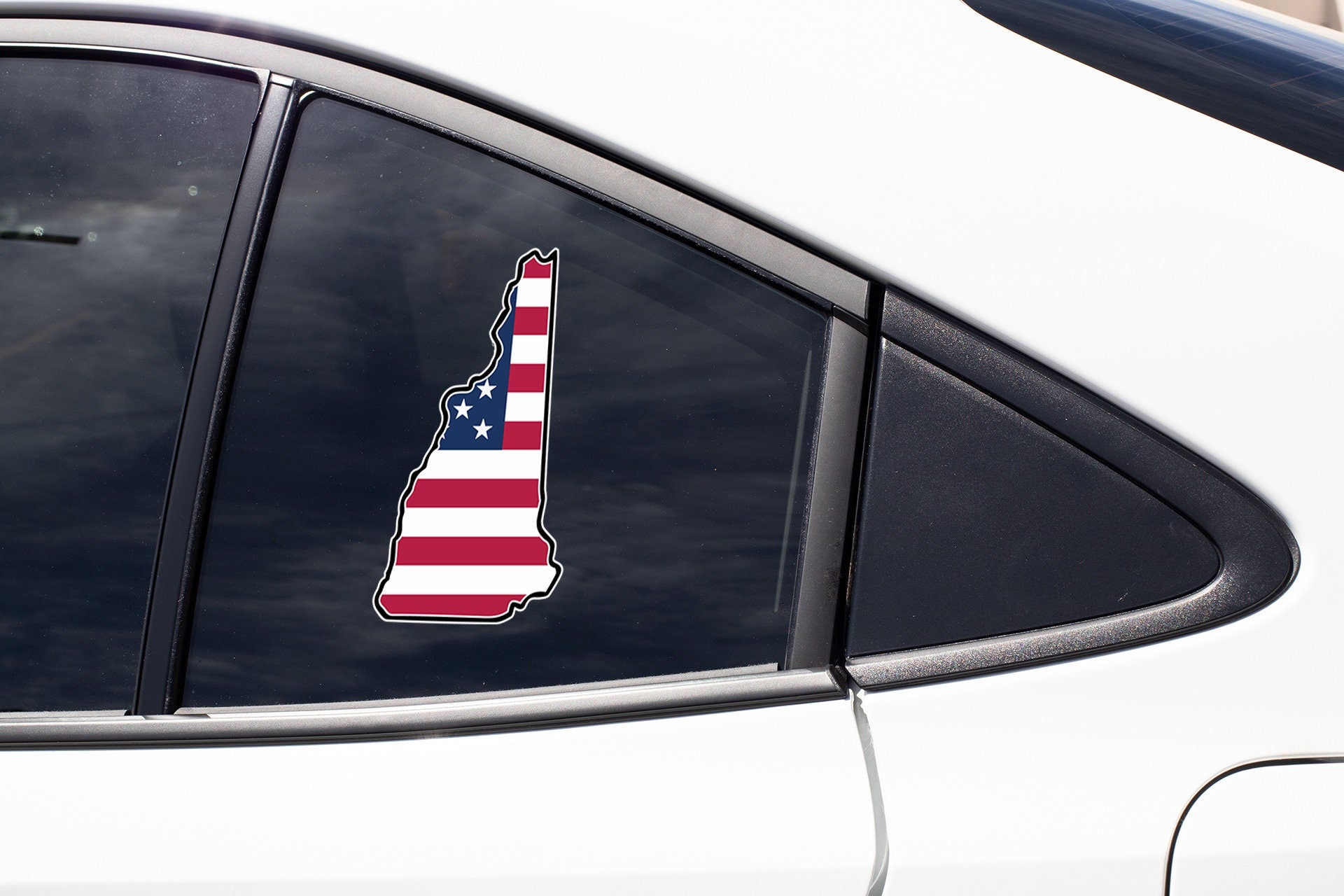 a car with a sticker of the state of new york on it