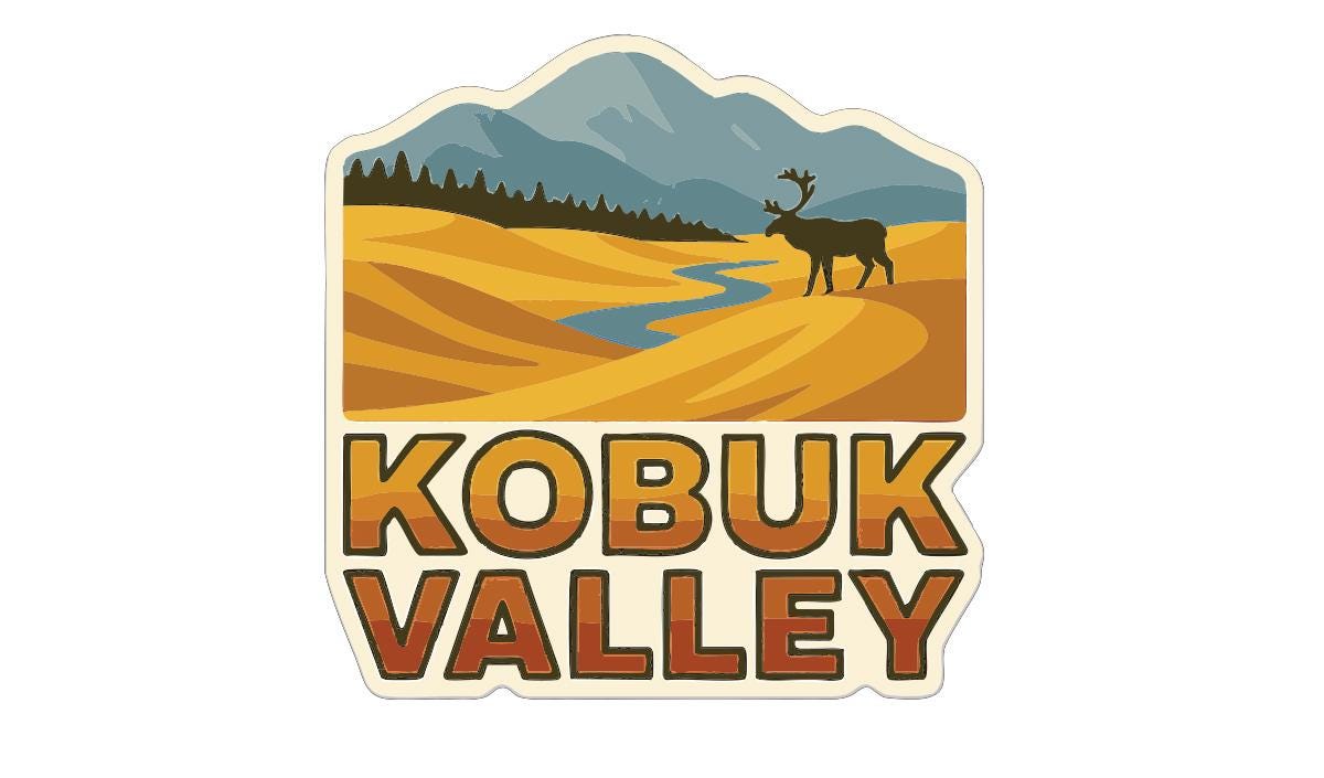 A sticker depicting a scenic landscape with mountains, a river, and a moose in the foreground, along with the text "KOBUK VALLEY" prominently displayed.