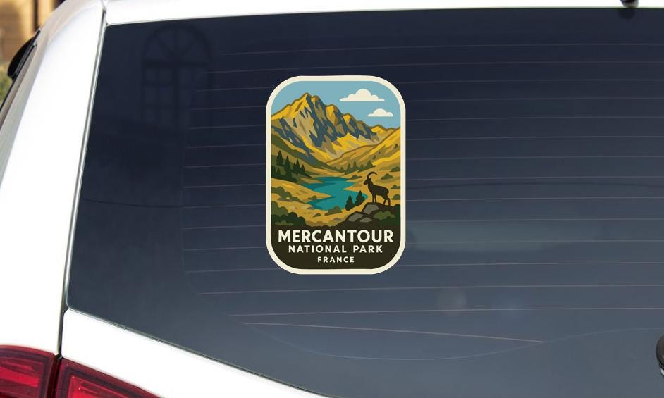 a sticker on the rear window of a car that says "MERCANTOUR NATIONAL PARK FRANCE".