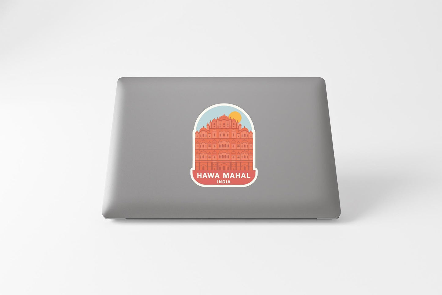 a sticker with an illustration of a building, likely representing the Hawa Mahal, a famous landmark in India.