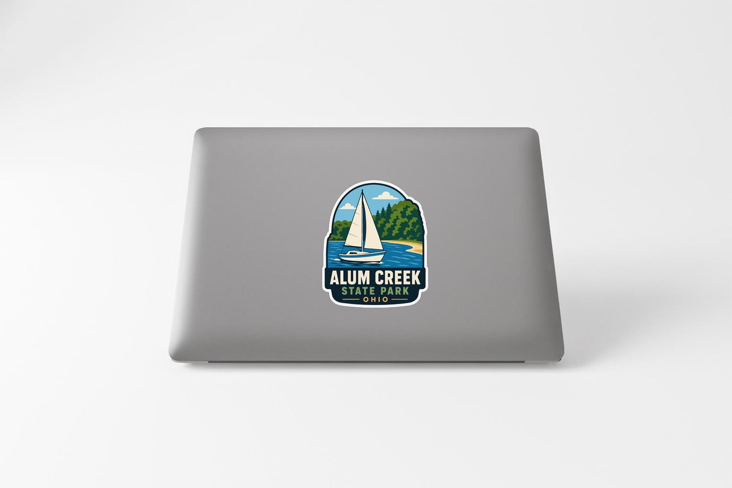 a sticker with a sailboat and a lake, representing Alum Creek State Park.