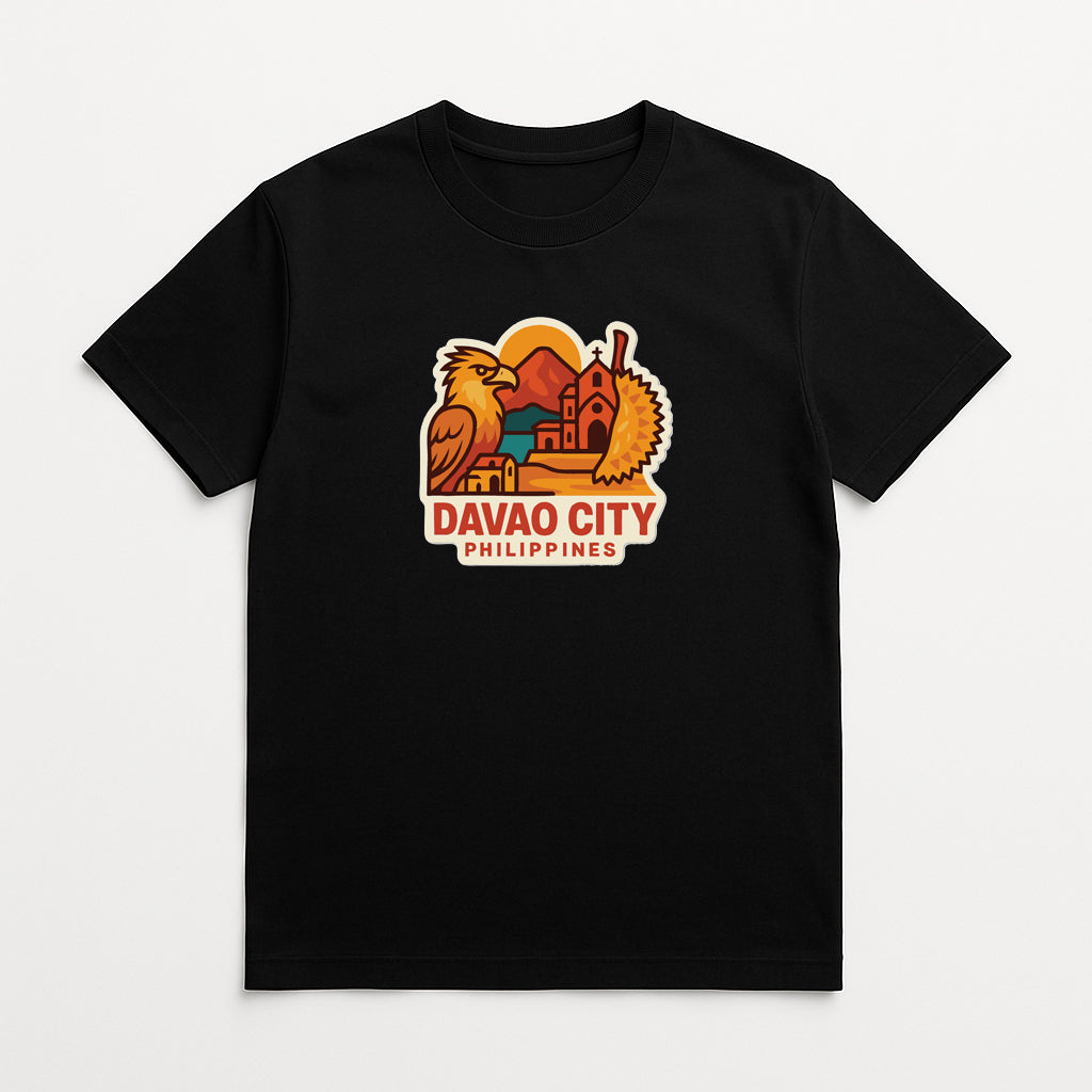 A black t-shirt with a graphic design depicting a bird, a building, and a sun, along with the text "DAVAO CITY PHILIPPINES".