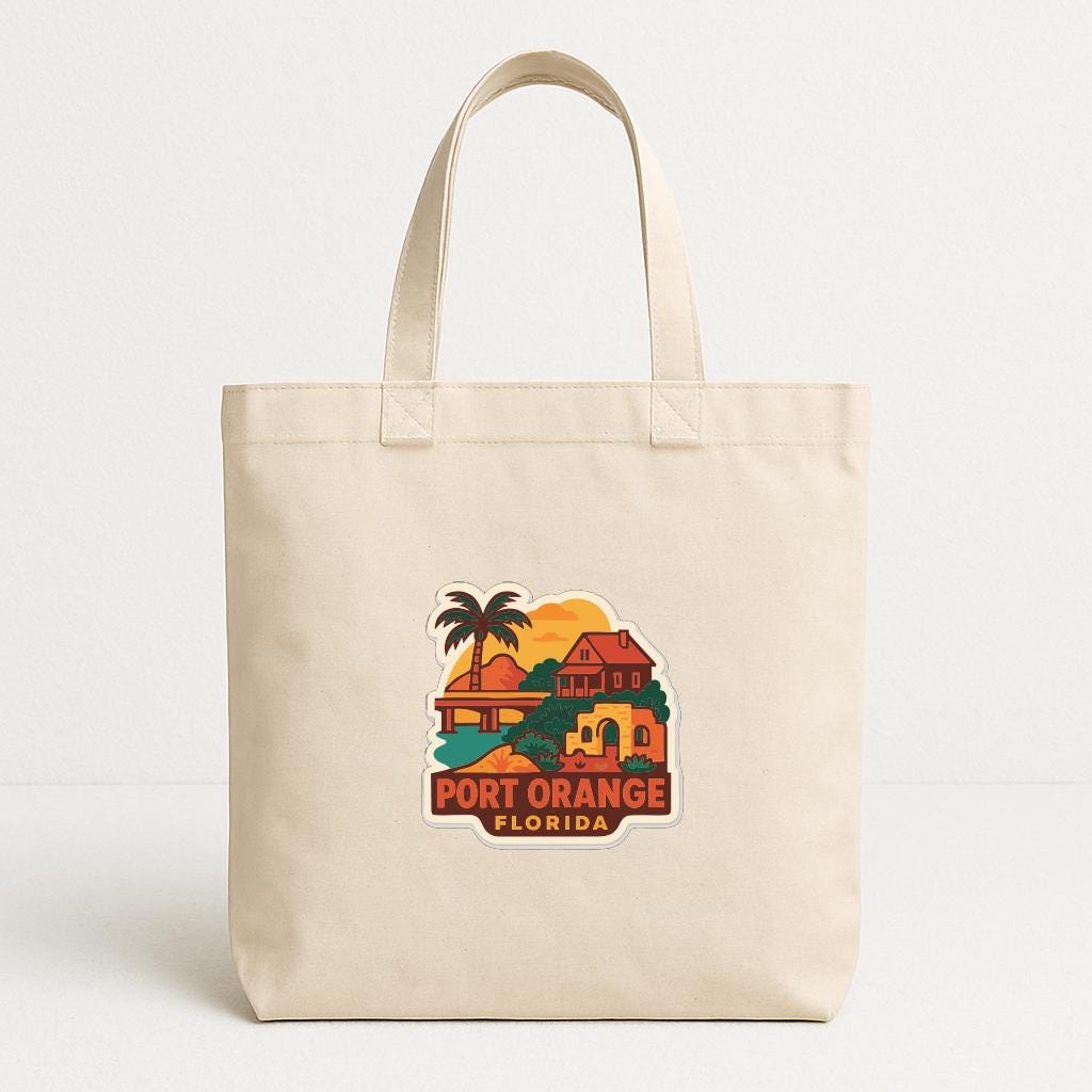 A beige tote bag with a printed design depicting a tropical beach scene and the text "PORT ORANGE FLORIDA".