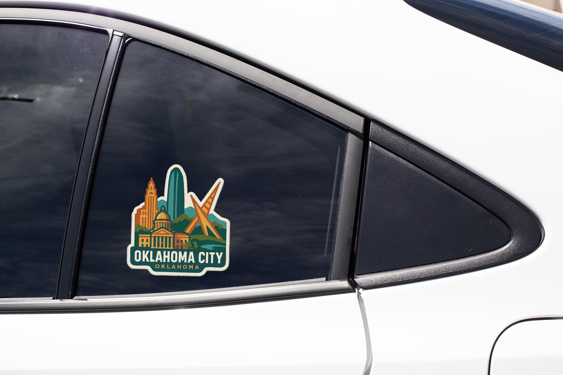 A sticker on the side of a car window, featuring the text "OKLAHOMA CITY" and an illustration of the city skyline.