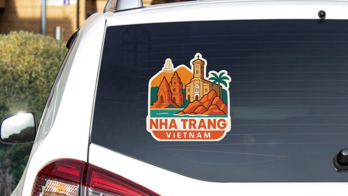 a sticker on the rear window of a car that displays the city of Nha Trang, Vietnam.