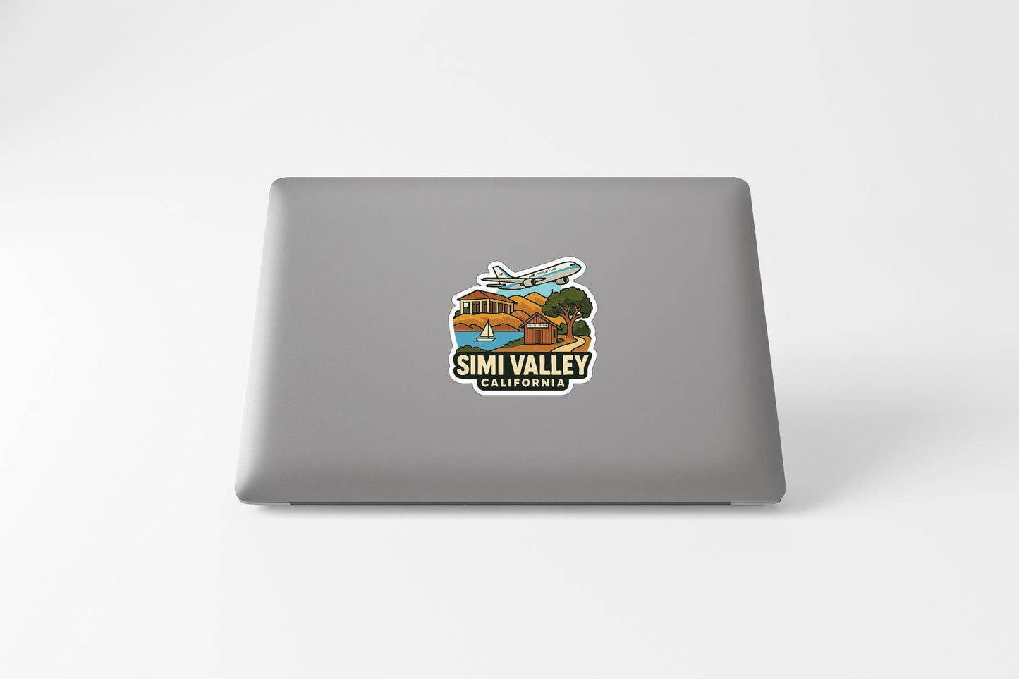 A sticker on the back of a laptop, depicting a scenic view of Simi Valley, California.