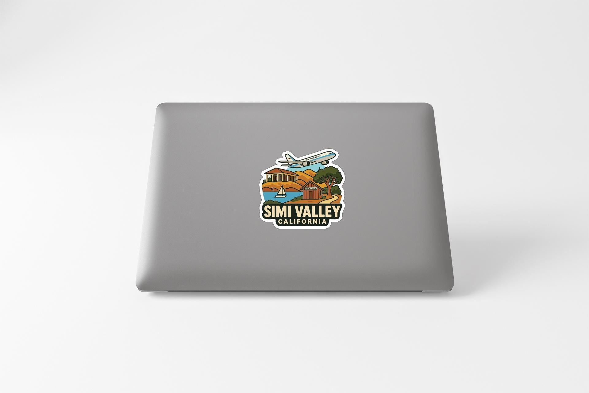 A sticker on the back of a laptop, depicting a scenic view of Simi Valley, California.