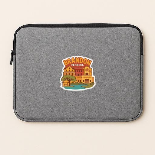 A gray laptop sleeve with a sticker depicting a colorful illustration of buildings and a body of water, representing the city of Brandon, Florida.