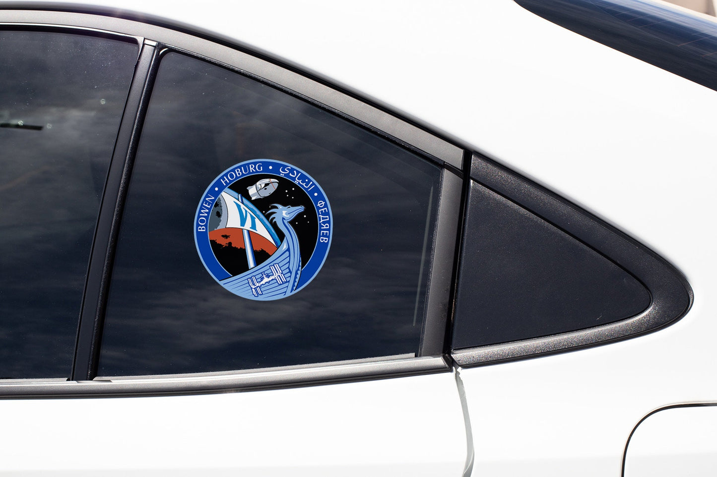 a close up of a car window with a nasa emblem on it