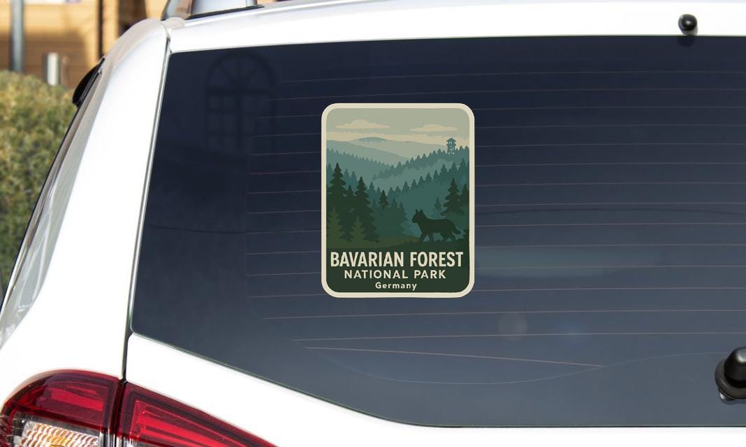 a sticker on the rear window of a car that says "BAVARIAN FOREST NATIONAL PARK GERMANY".