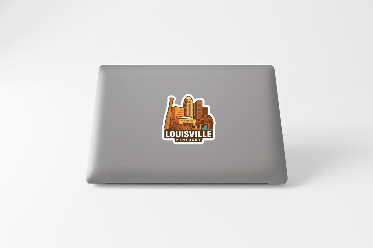 A sticker depicting the skyline of Louisville, Kentucky, on the back of a laptop computer.