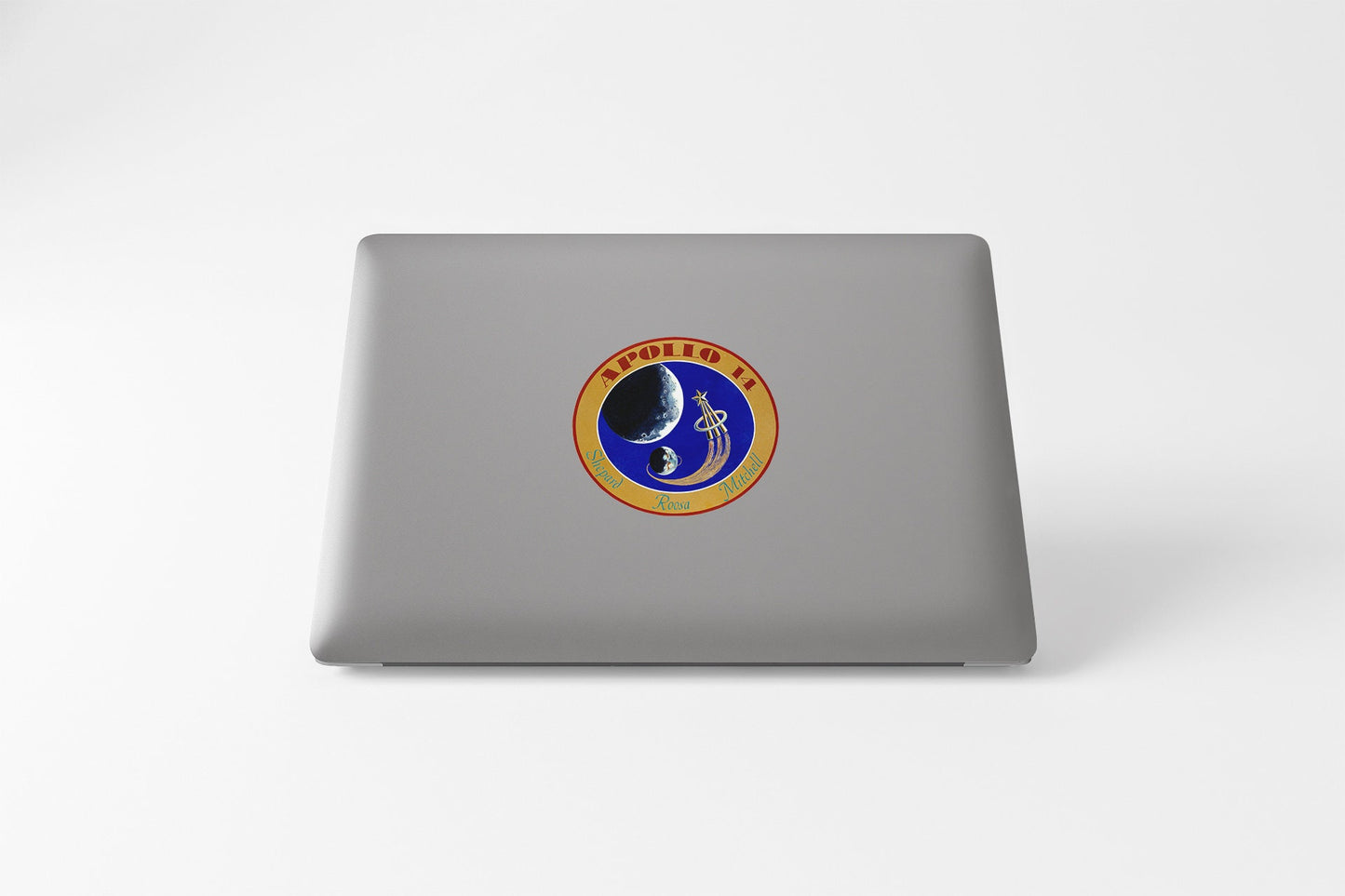 a laptop with a sticker of a man on it
