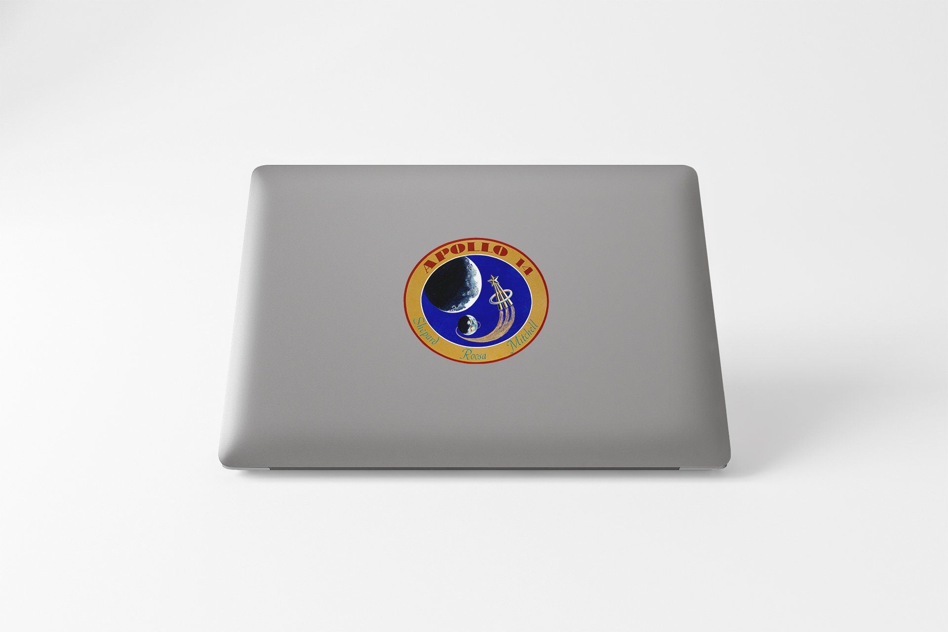 a laptop with a sticker of a man on it
