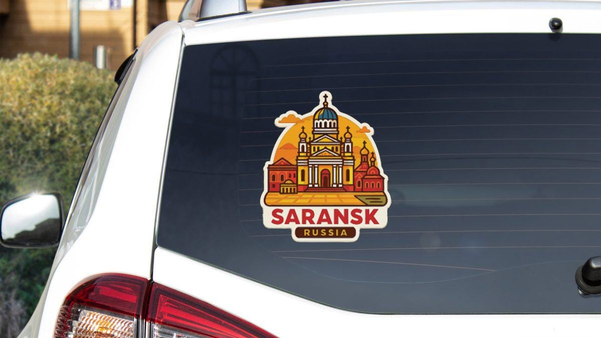 A sticker on the rear window of a car that features an illustration of Sarank Cathedral in Sarank, Russia.