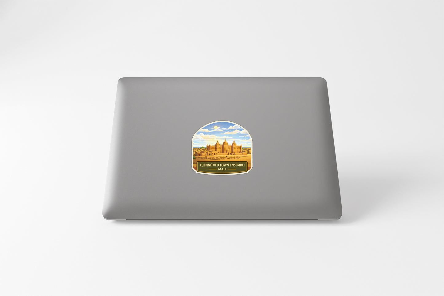 a sticker with a picture of a temple on a laptop.