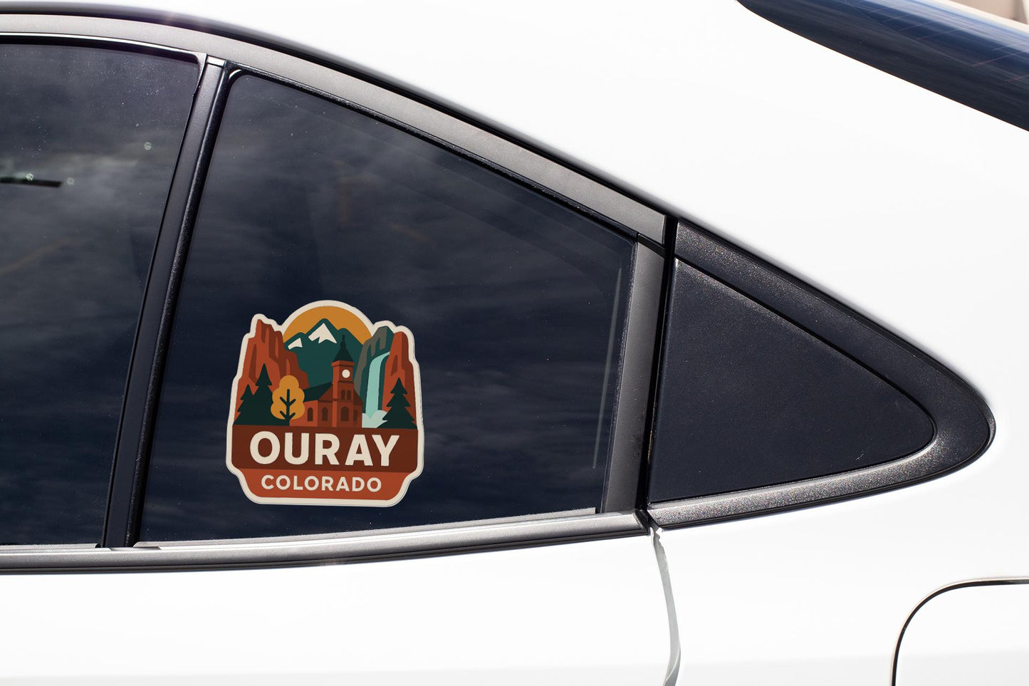 A sticker on the side of a car window that says "OURAY COLORADO".