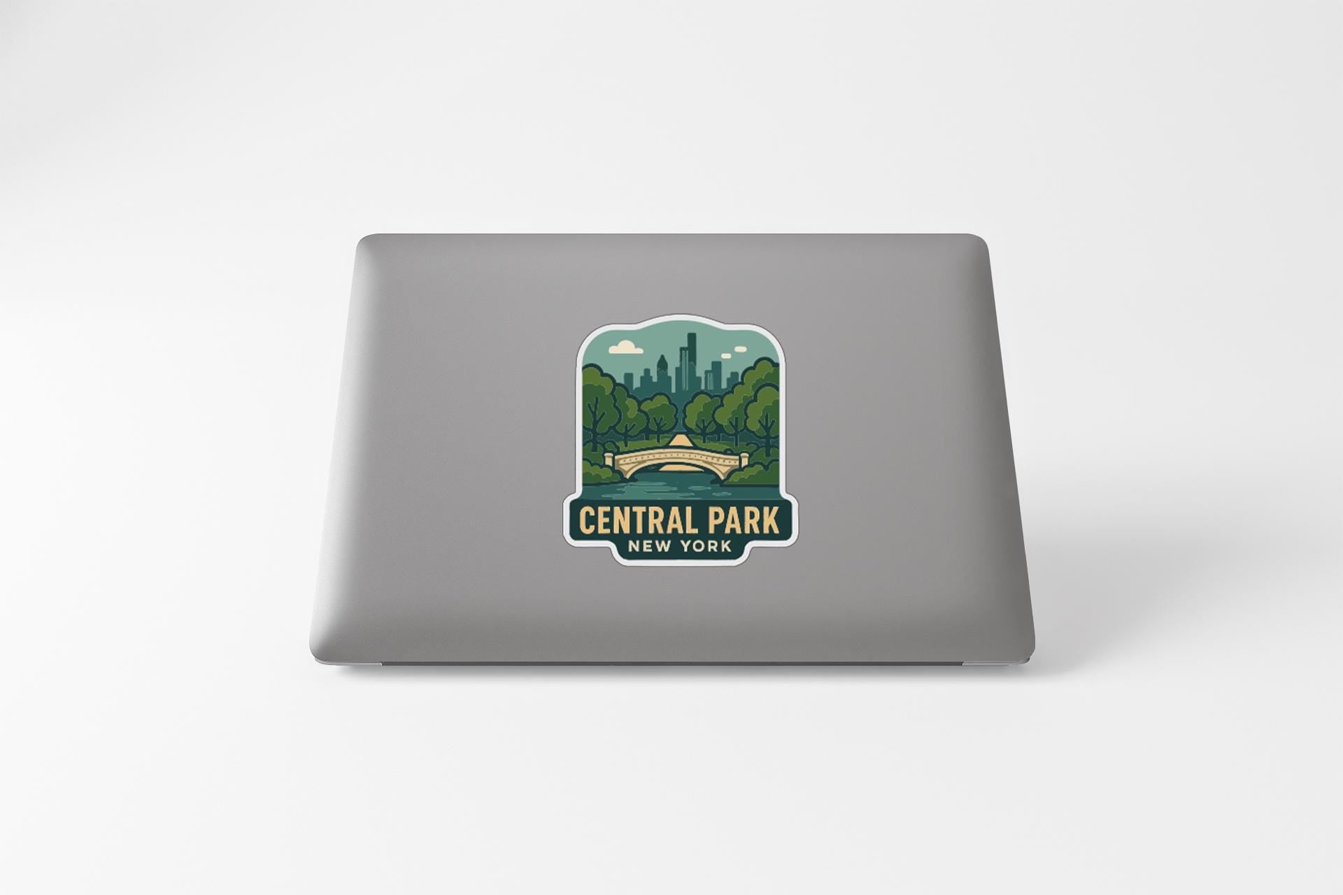 a sticker or decal of Central Park, New York, on the back of a laptop computer.
