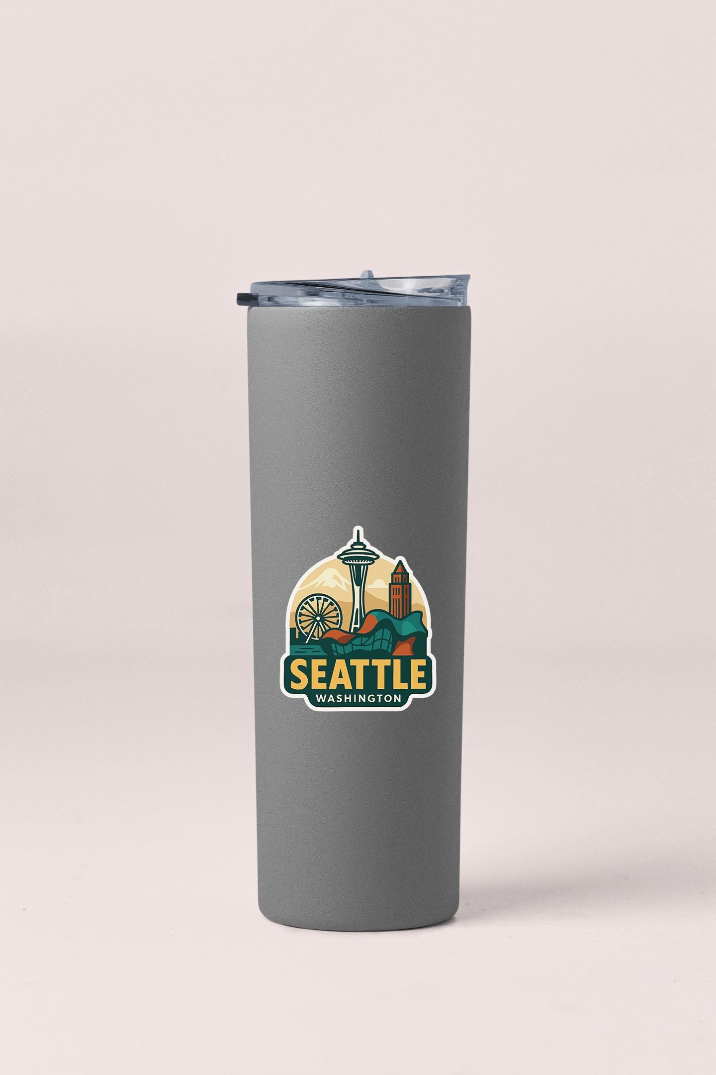 a stainless steel tumbler with the seattle logo on it
