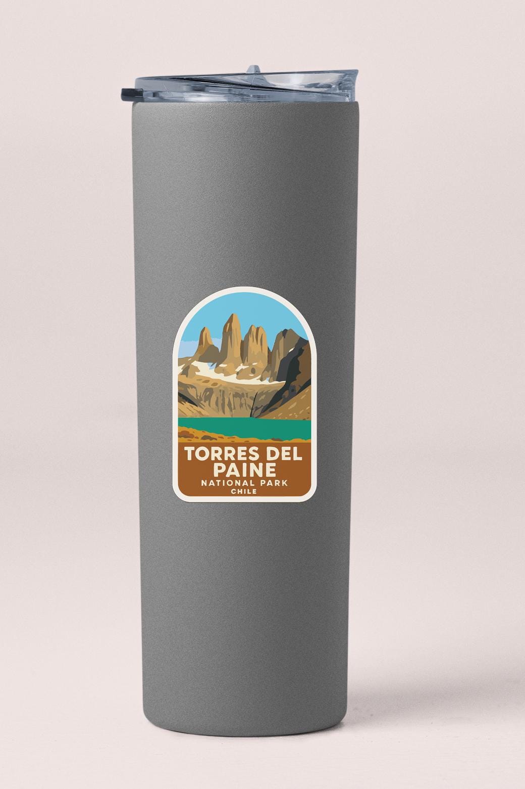 A gray insulated tumbler with a label that says "Torres del Paine National Park CHILE".