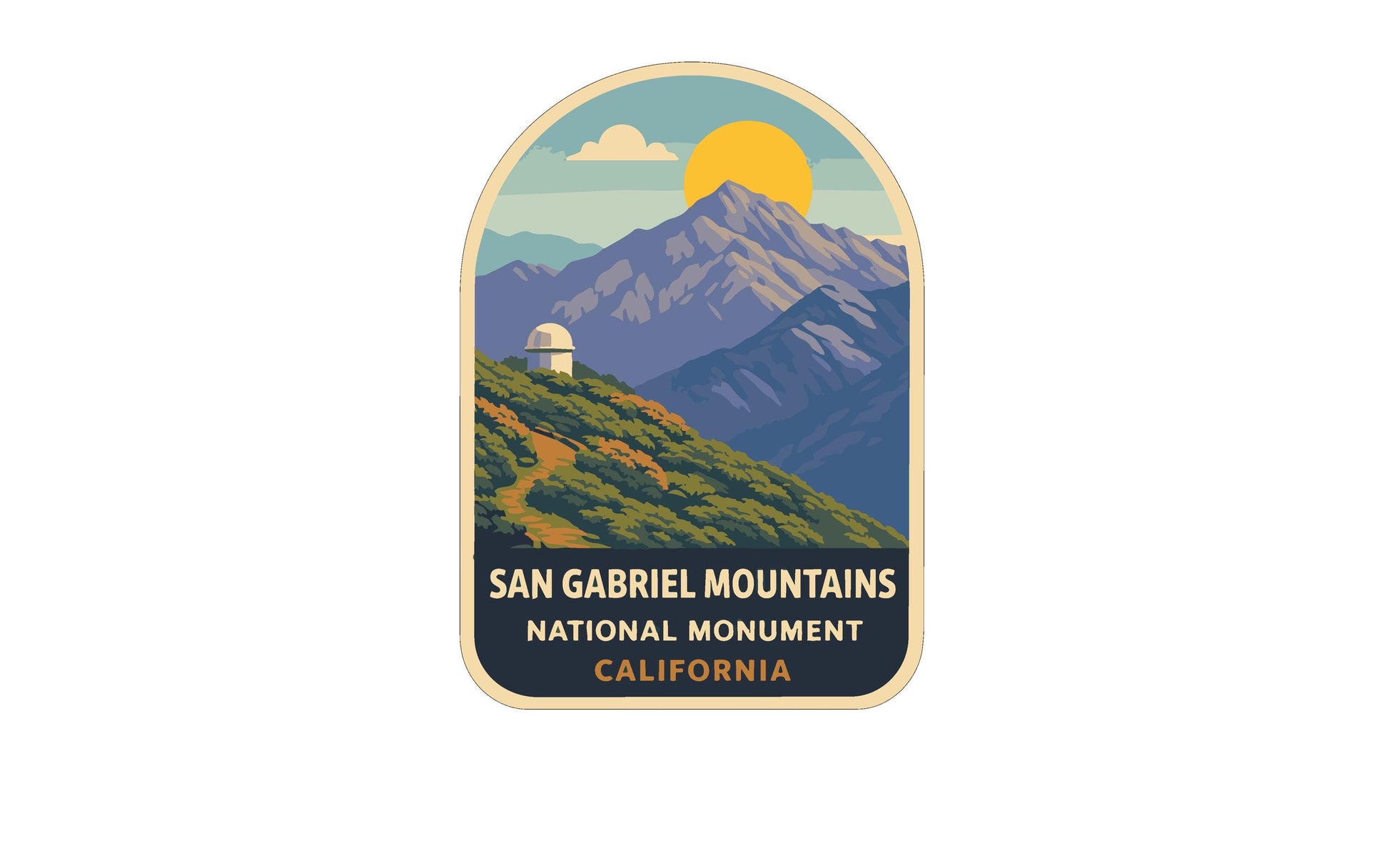 a sticker or emblem with a mountain landscape and a dome-shaped structure, likely representing the San Gabriel Mountains National Monument in California.